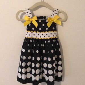 Black and white polka dot dress with yellow bows